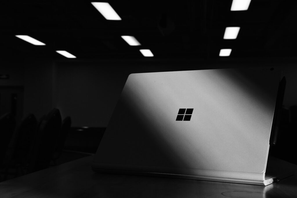 Microsoft surface pro 8 is in the dark shadow and in the table.