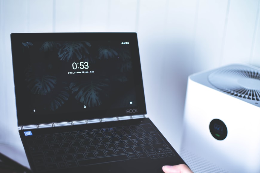 This image shows the laptop with a fan in front of white background. I will tell you How to check your laptop fan is working or not.